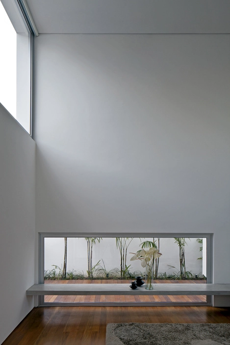 Double-height living space showing the low window looking at lat