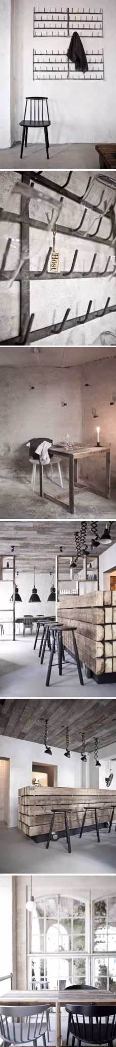 Tira vertical de interiores con paredes claras, estanterías, mesas de madera y lámparas negras colgantes