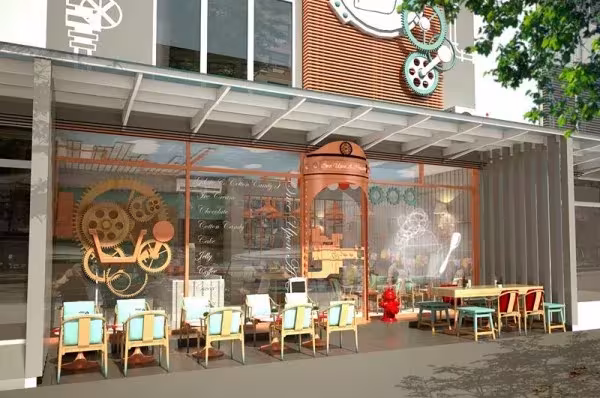 Fachada acristalada de la heladería Once Upon A Cream en Tailandia, con engranajes decorativos y terraza de sillas de colores