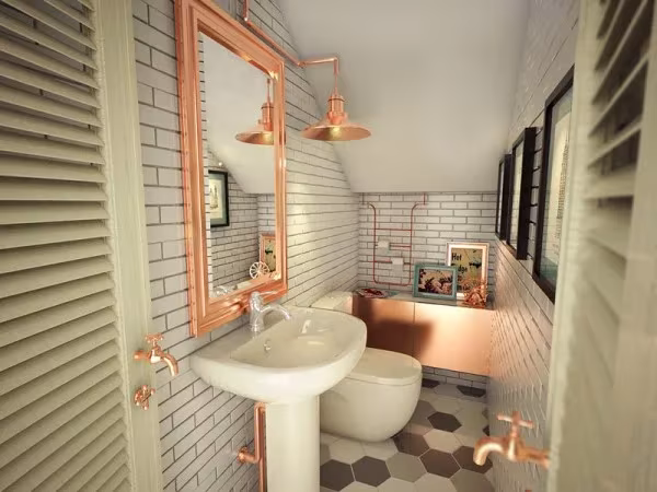 Aseo de la heladería Once Upon A Cream con espejo de marco de cobre, lavabo blanco y suelo de baldosas hexagonales