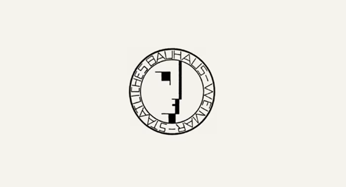 Logotipo de la Bauhaus de Weimar, un perfil geométrico dentro de un círculo con letras