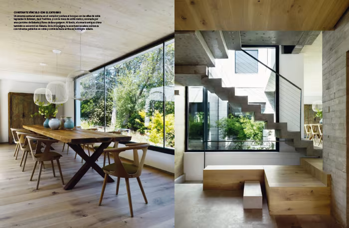 Doble página de Nuevo Estilo con el comedor de mesa de madera bajo un ventanal y la escalera de hormigón con bancos