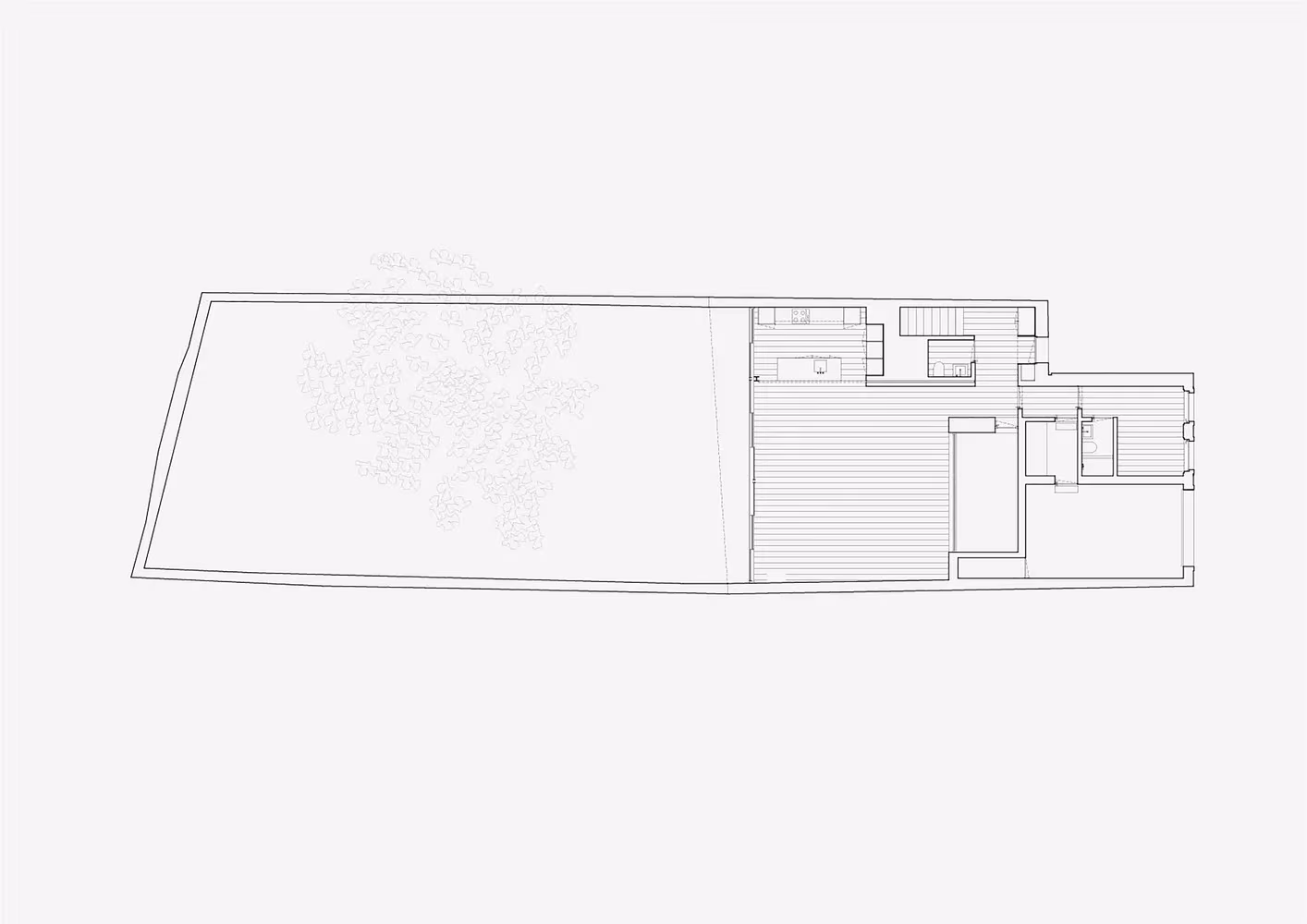 Planta baja de la Casa Brotero de phdd arquitectos con salón abierto al jardín trasero de Lisboa