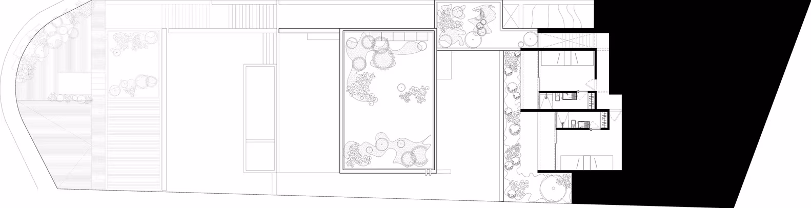Plano de la planta superior de la Casa Tucán con el patio central y los dormitorios, sobre fondo de ladera