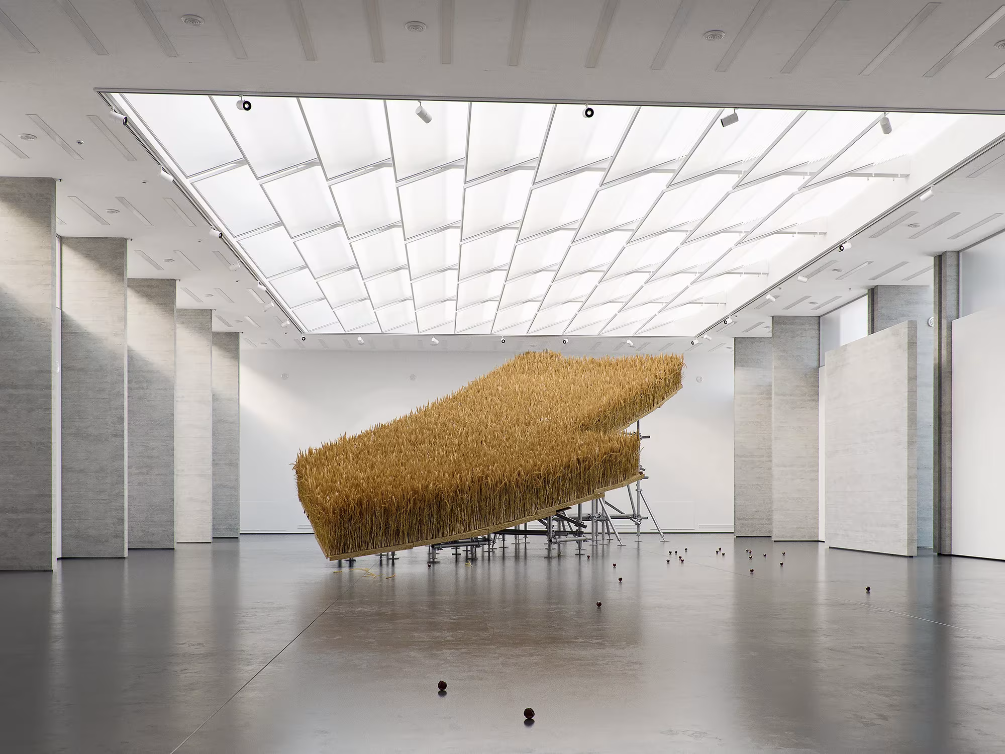 Escultura de hierba seca flotando bajo un gran lucernario en una sala de museo, obra de Tadao Cern