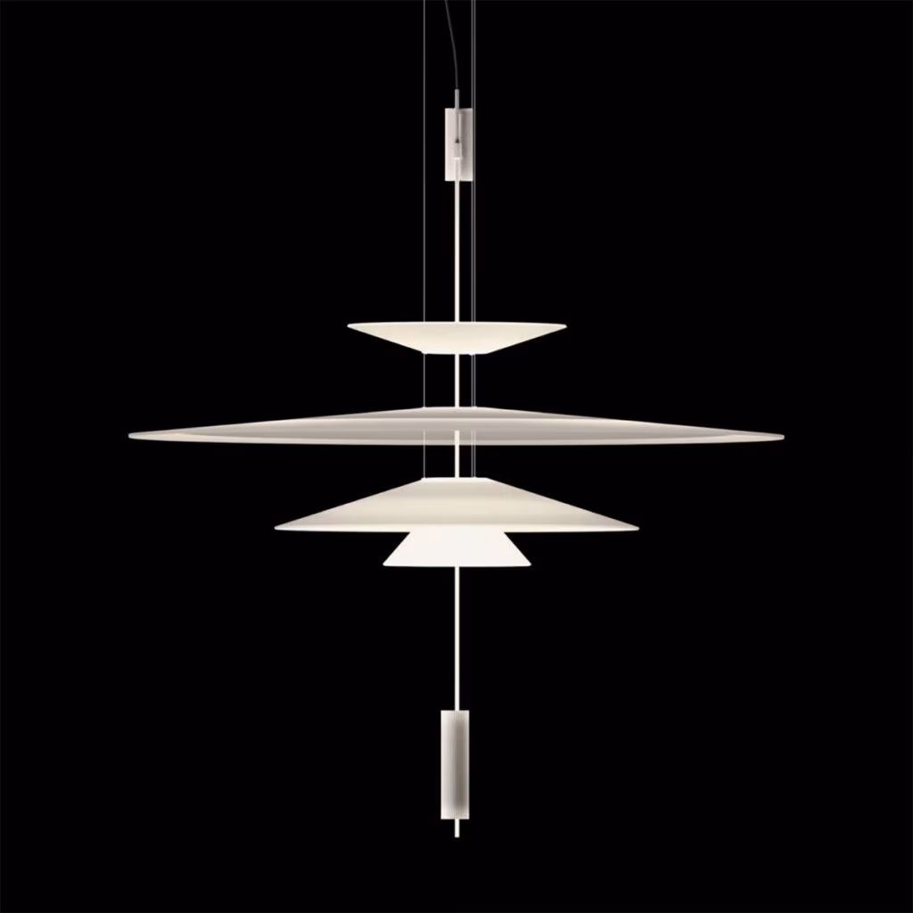 Vibia Flamingo pendant lamp with stacked white discs against a black background
