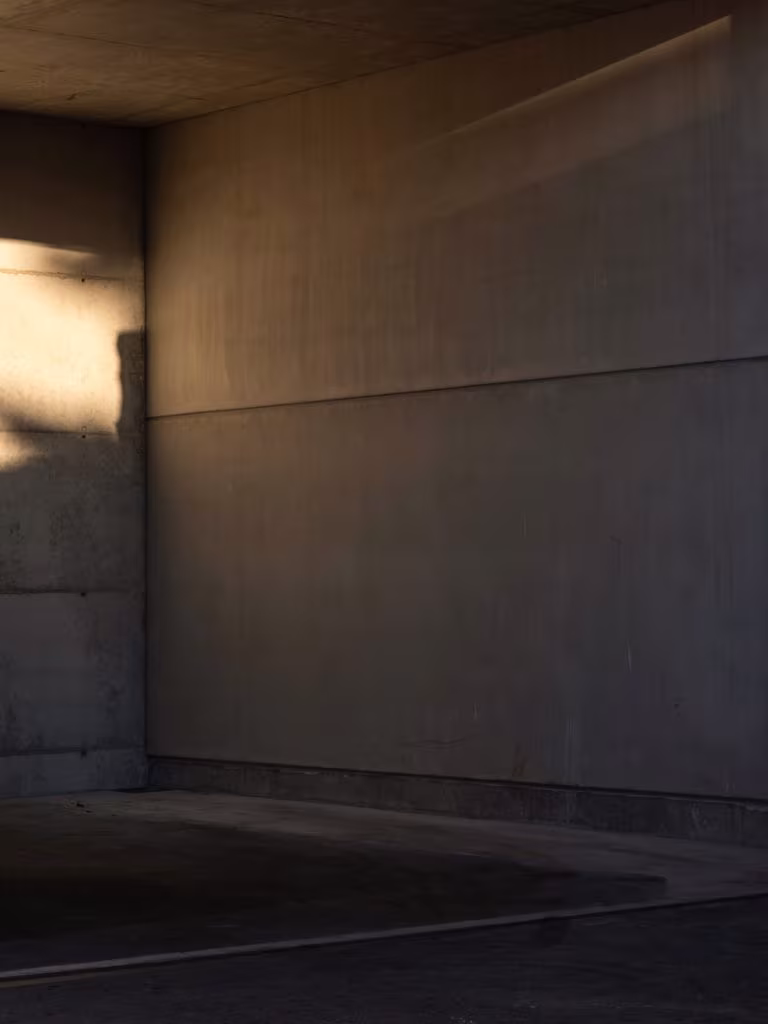 Shaded exposed concrete corner with raking light at the CVNE winery