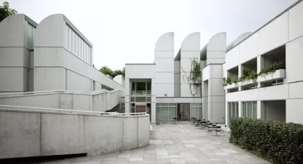 Bauhaus-Archiv in Berlin, with saw-tooth roofs and white façades around a stone courtyard